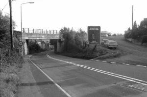 Railway bridge crossing the A37 (Pensford Hill) looking south from Station Approach